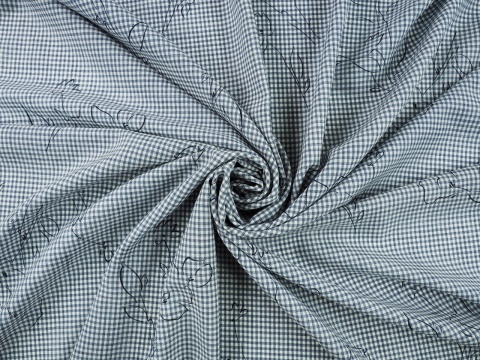 wełna w biało-niebieską, drobną kratkę i czarne szkice kwiatów