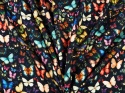 czarna wiskoza w drobne, kolorowe motyle gęsto rozmieszczone