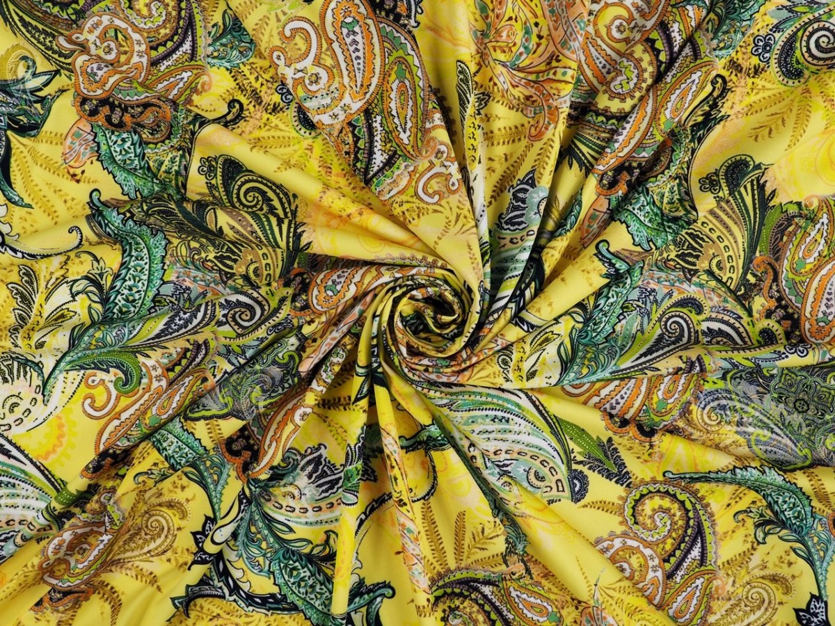 Lycra dzianina - Kolorowe paisley na kanarkowym tle Lycra dzianina - Kolorowe paisley na kanarkowym tle