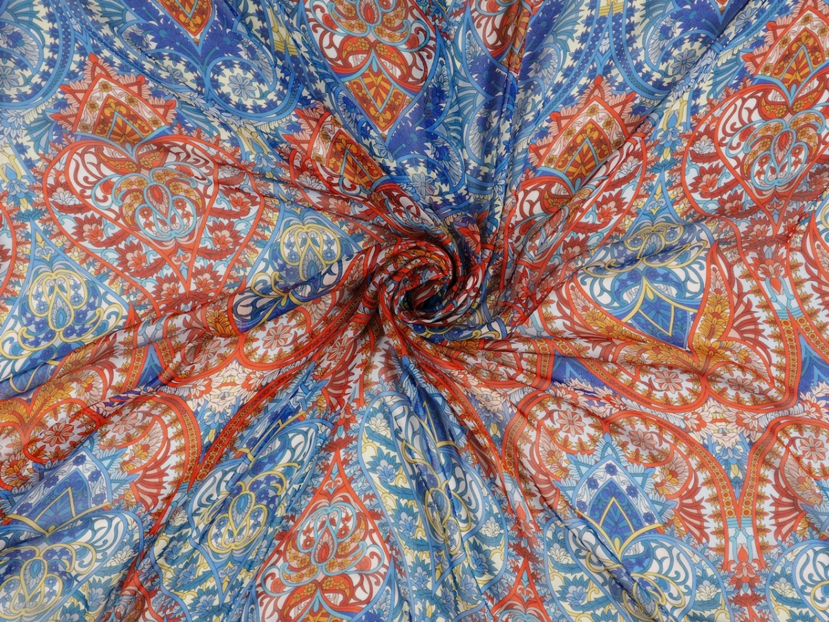 Jedwab szyfon - Pomarańczowe i niebieskie ornamenty Jedwab szyfon - Pomarańczowe i niebieskie ornamenty
