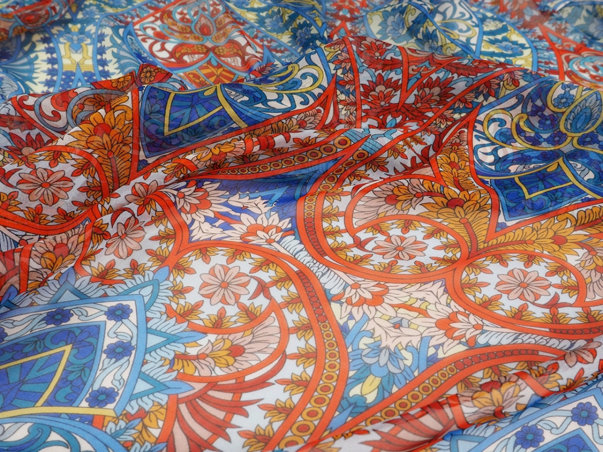 Jedwab szyfon - Pomarańczowe i niebieskie ornamenty Jedwab szyfon - Pomarańczowe i niebieskie ornamenty