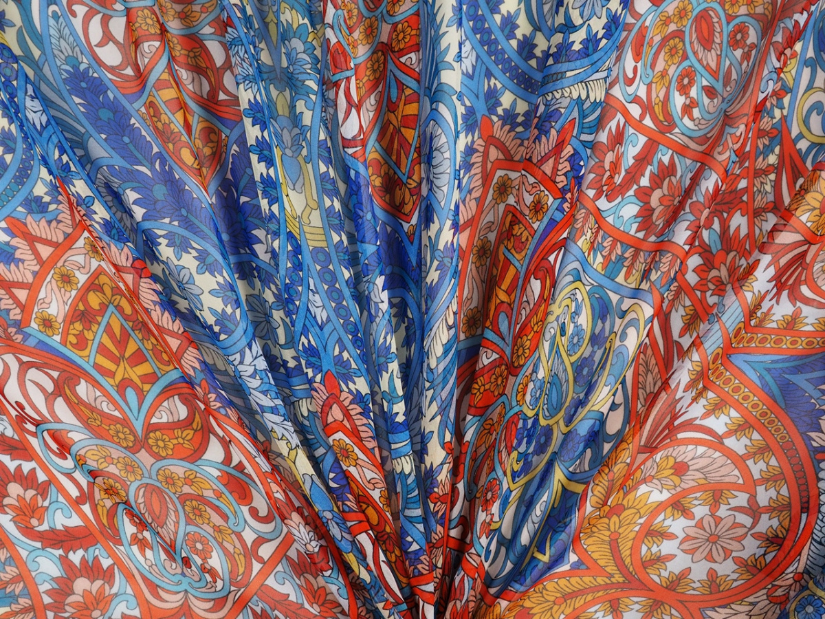 Jedwab szyfon - Pomarańczowe i niebieskie ornamenty