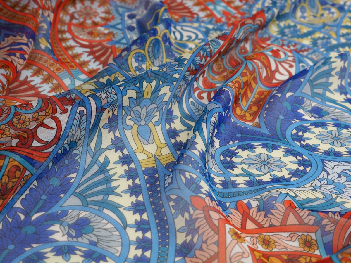 Jedwab szyfon - Pomarańczowe i niebieskie ornamenty Jedwab szyfon - Pomarańczowe i niebieskie ornamenty