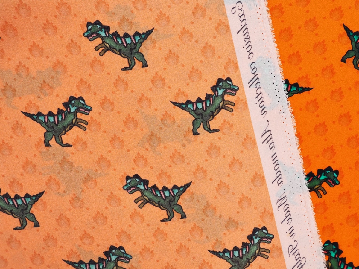 Jedwab naturalny - Dinozaury na pomarańczowym tle
